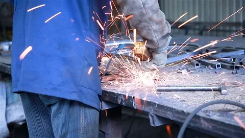 A worker cuts a piece of the workpiece Stock Footage 97730810