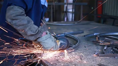 Worker cuts pieces of metal Stock Footage 97749907