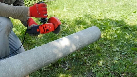 Worker, cuts the pipe from asbestos Stock Footage 76967665