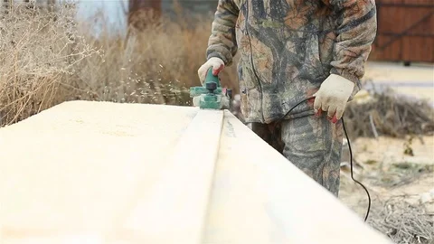 Worker cuts the surface of the board Stock Footage 97858851