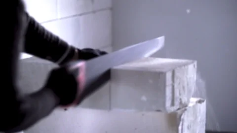 The worker cuts unit blocks in the house Stock Footage 90190565