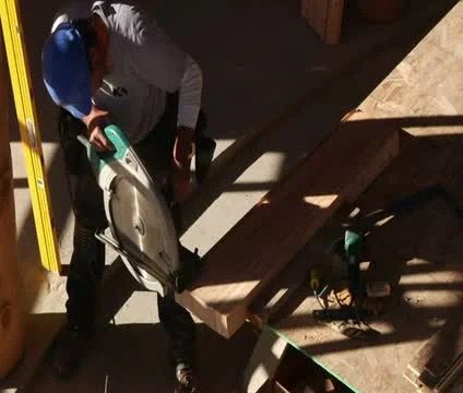 Worker cuts wood with saw Stock Footage