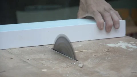 Worker cuts a wood with some electric device or appliance Stock Footage 83779337