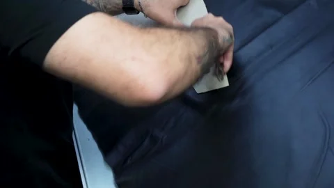 Worker Cutting Black Leather Material in Garment Factory, Izmir - 4 SEP 2025 Stock Footage 322057608