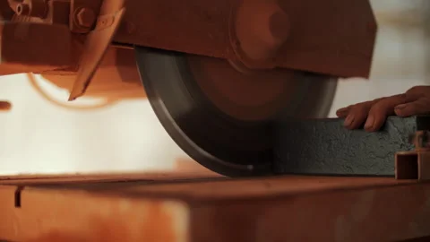Worker cutting brick with circular saw at construction site Stock Footage 316702201
