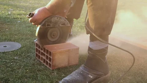 Worker cutting the brick drill Stock Footage 75769368