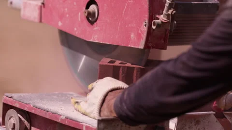 Worker cutting ceramic brick with masonry saw close up Stock Footage 341987304