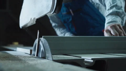 Worker cutting detail in shop Stock Footage 100547852