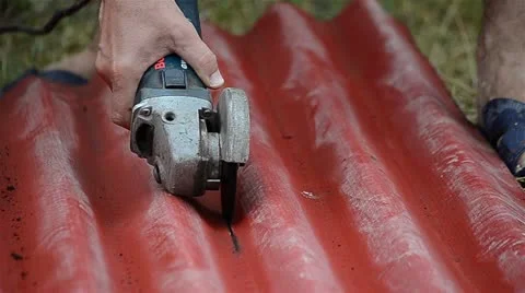 Worker cutting with electric grinder Stock Footage 13152949