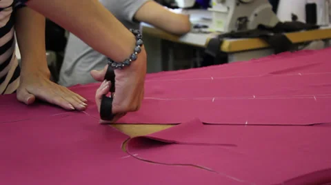 Worker cutting fabric 1 Stock Footage 33450566