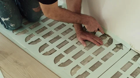Worker Cutting Foam Underlayment Sheet During Floor Installation Stock Footage 322055487