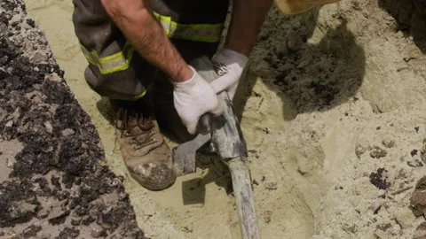 The worker is cutting the insulation of the power transmission line cable using Stock Footage 244638502