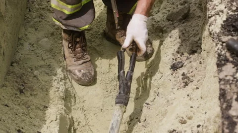 The worker is cutting the insulation of the power transmission line cable using Stock-Footage 244640056
