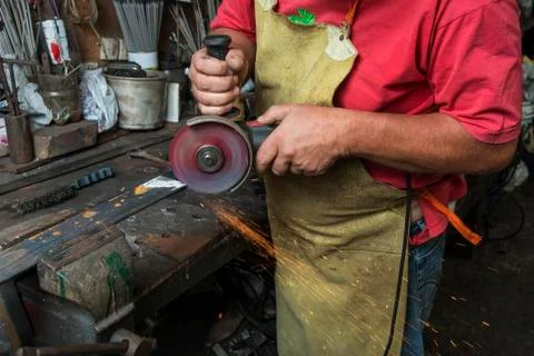 Worker cutting iron Stock Photos