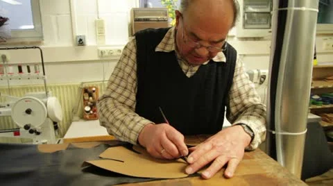 Worker cutting leather Stock Footage 10812117