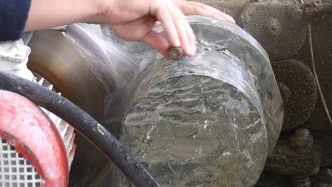 Worker cutting marble or malachite by lathe tool. Knocking the edge Stock-Footage 72782887