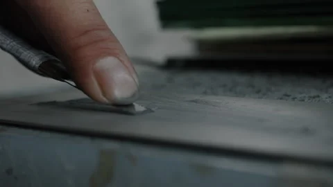 Worker Cutting Material by Hand with Utility Knife in Shoe Manufacturing Process Stock Footage 341668594