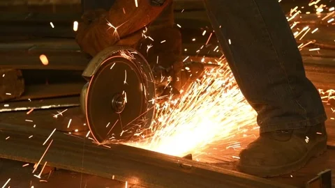 Worker cutting metal angle bar by grinder machine with sparks Stock Footage 91165526