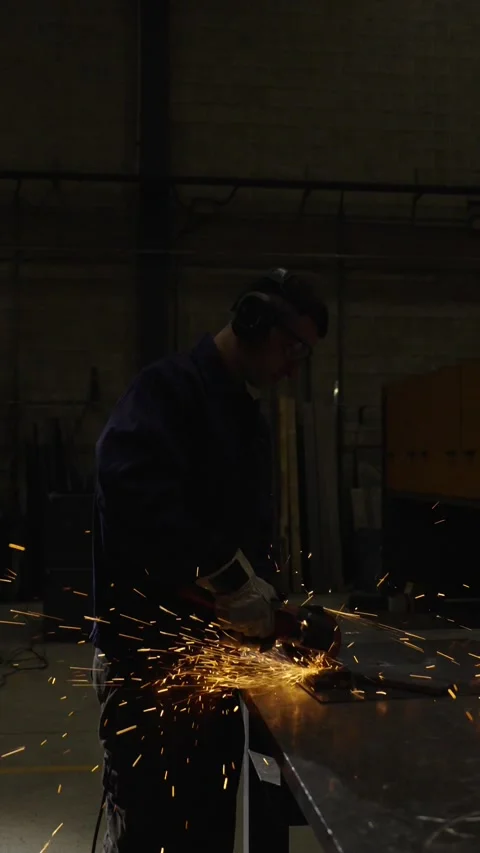 Worker cutting metal in the darkness Stock Footage 266070590