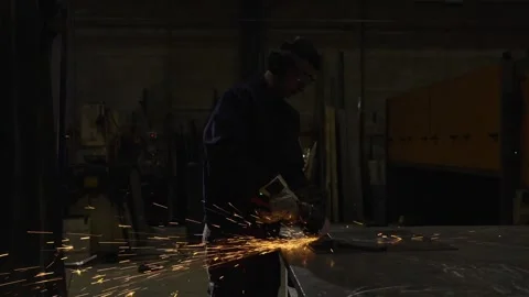 Worker cutting metal in the darkness Stock Footage 266606384