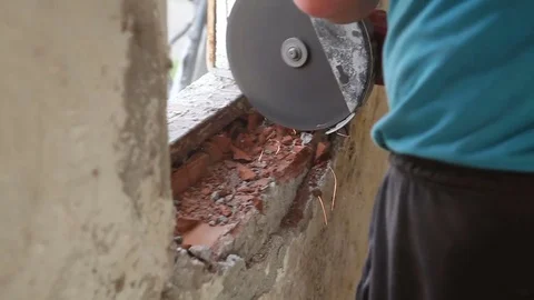Worker cutting the metal frame witha drill Stock Footage 75770369