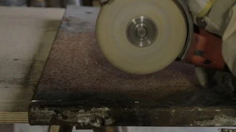 Worker cutting metal with grinder Stock Footage 73165682