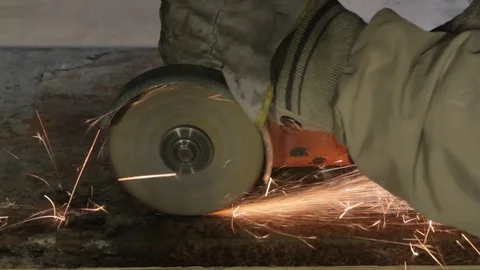 Worker cutting metal with grinder Stock Footage 73167807