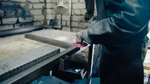 Worker cutting metal with grinder Video stock 146801417