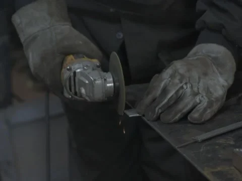 Worker cutting metal with grinder. Stock Footage 255130695