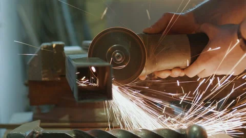 Worker cutting metal with a power tool Stock Footage 89549680