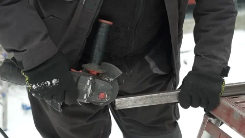 Worker cutting metal tube using an Angle Grinder. Bright sparks and flashes Stock-Footage 259027489