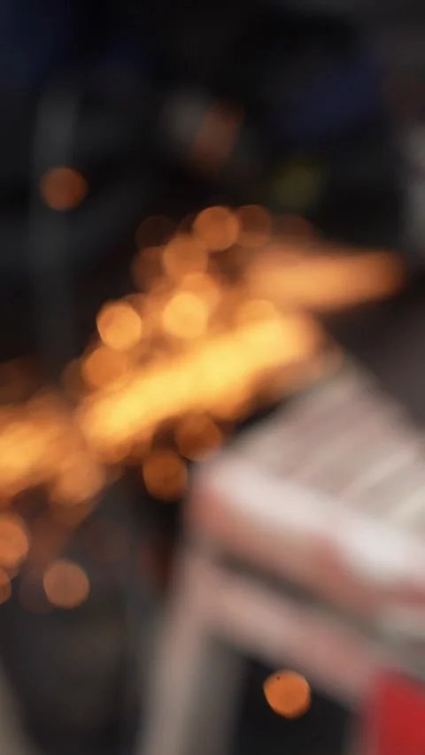 Worker cutting metal tube using an Angle Grinder. Bright sparks and flashes Video stock 263186521