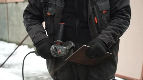 Worker cutting metal tube using an Angle Grinder. Bright sparks and flashes Video stock 263186581
