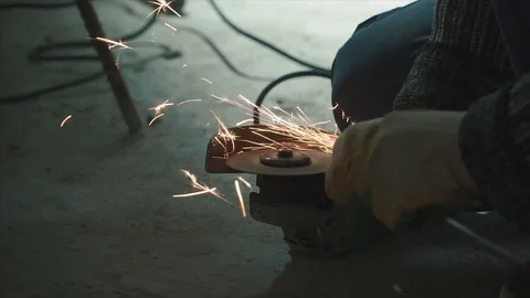 Worker cutting Old Metal using angular grinding machine. Clip. Angular grinding Stock Footage 85965464