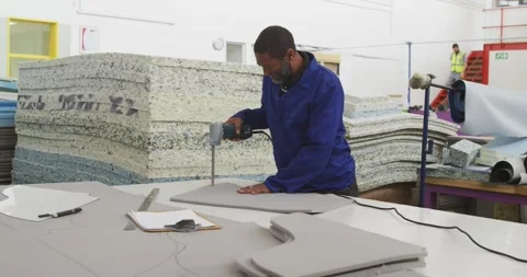 Worker cutting the pattern on a cardboard Stock Footage 343096128