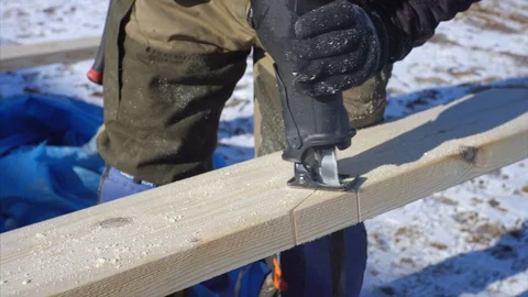 Worker is cutting pattern in plywood using a bandsaw, or jigsaw or scroll saw Stock Footage 125220088