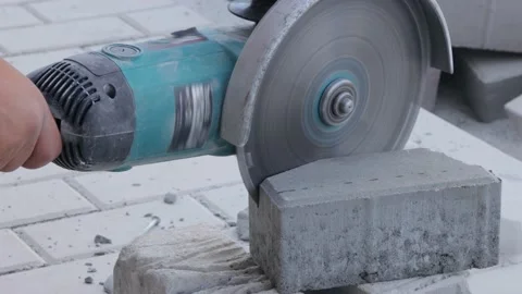 Worker cutting paving stone with angle grinder 스톡 동영상 162748180
