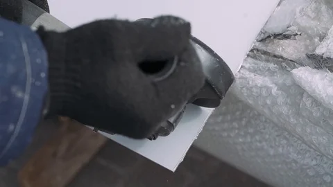 Worker cutting the plastic material through angular grinding machine. Stock Footage 74732625