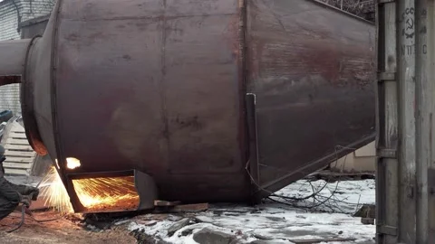Worker is cutting rusty metalwork with oxy-fuel gas cutting torch. Stock Footage 145991937