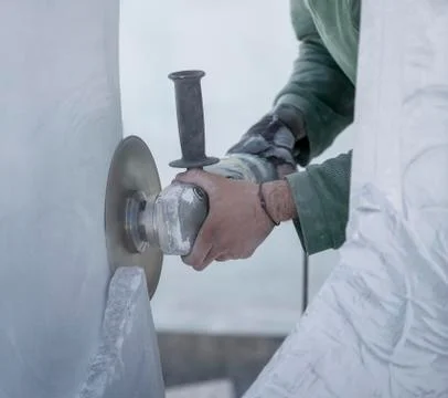 Worker cutting stone with grinder Stock Photos