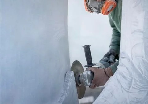 Worker cutting stone with grinder Stock-Fotos