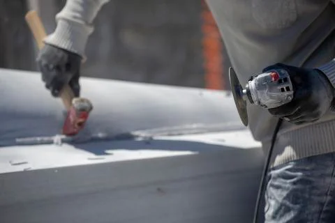 Worker cutting stone with grinder Stock Photos