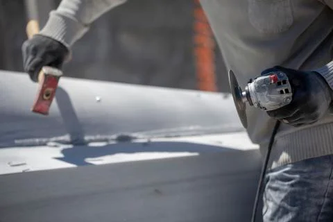 Worker cutting stone with grinder Stock Photos