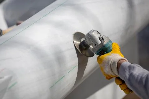 Worker cutting stone with grinder Stock Photos
