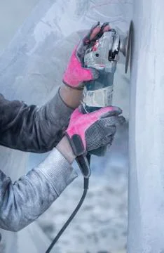 Worker cutting stone with grinder 스톡 사진