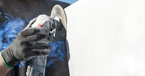 Worker cutting stone with grinder Stock Photos
