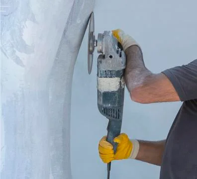 Worker cutting stone with grinder Stock Photos
