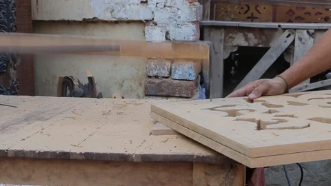 A Worker Cutting Wood Design using electric cutter machine Stock Footage 86654189