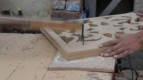 A Worker Cutting Wood Design using electric cutter machine Stock Footage 86654435