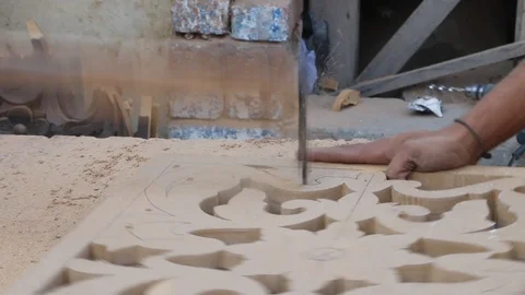 A Worker Cutting Wood Design using electric cutter machine Stock Footage 86654444